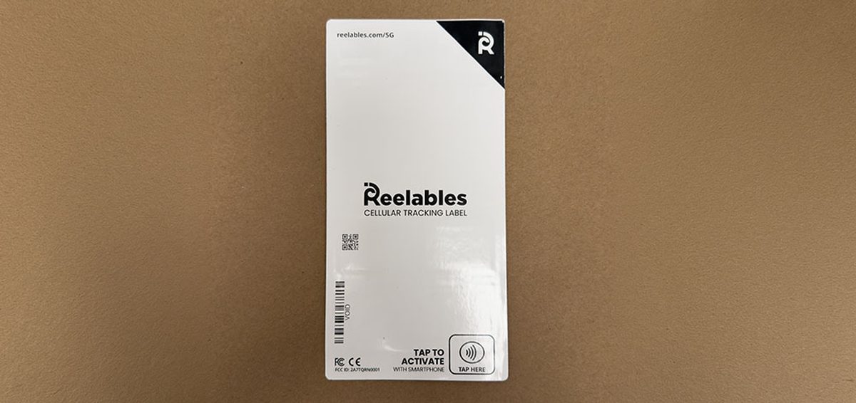 The cellular tracking label, showing the tap-to-activate NFC area and the
                  regulatory markings.